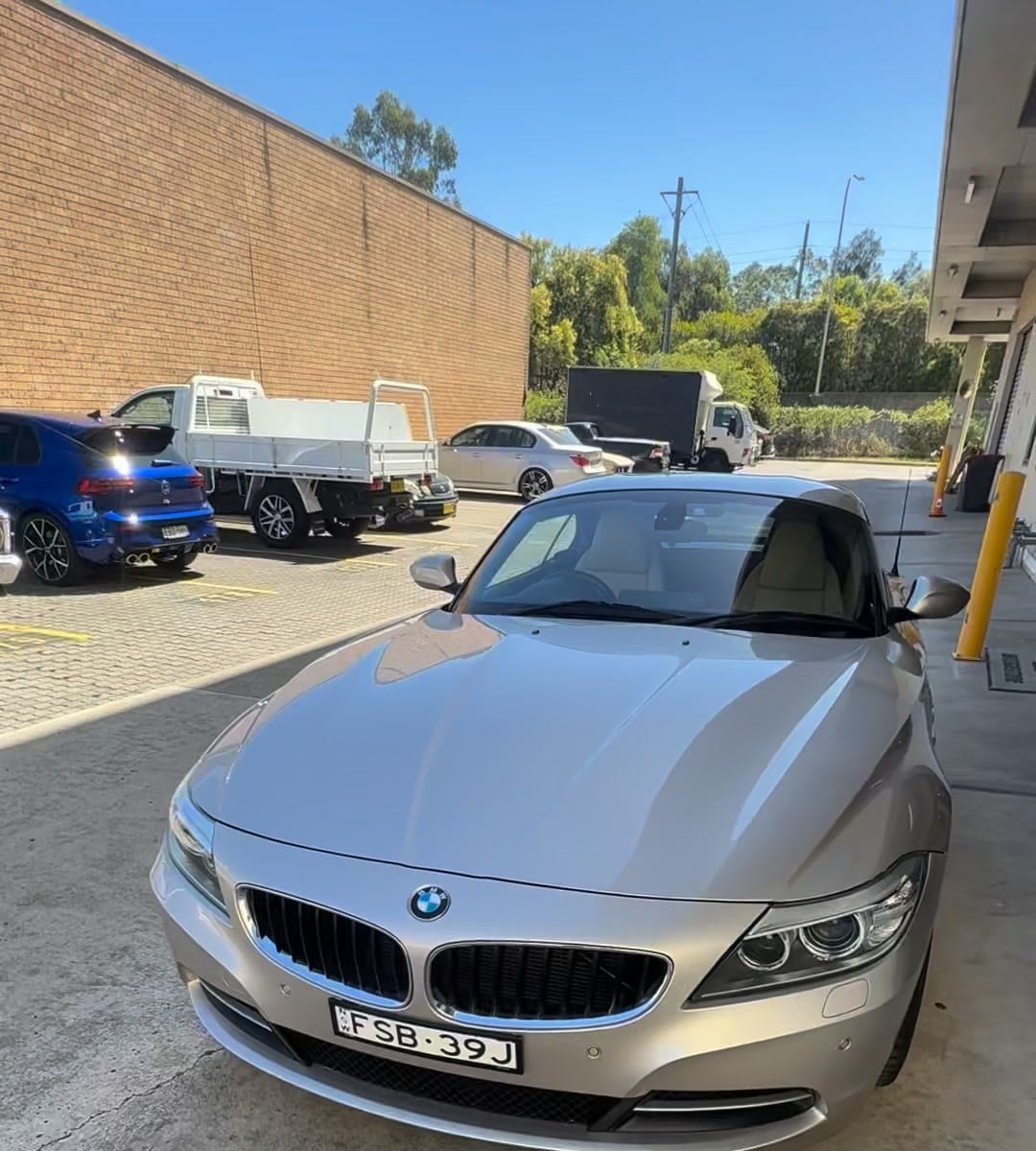 A silver 2013 BMW Z4 in the covered bay at Hills Cars Direct, Boden Road, Seven Hills